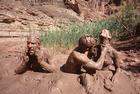 People Playing in the Mud